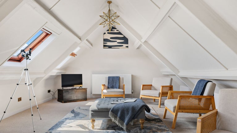 The converted attic room at Labour in Vain Cottage, perfect for stargazing, relaxing and playing family games